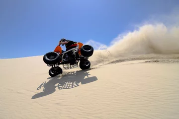 Foto op Aluminium Male riding ATV tipped on 2 wheels sand dune in Oregon. © Raven