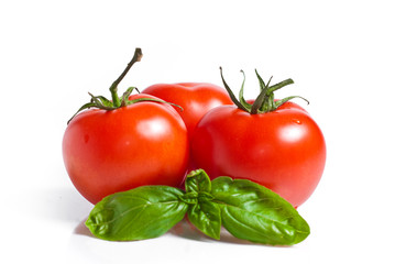 fresh red tomatoes isolated on white background