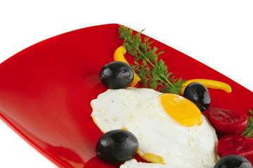 fried egg served on red dish