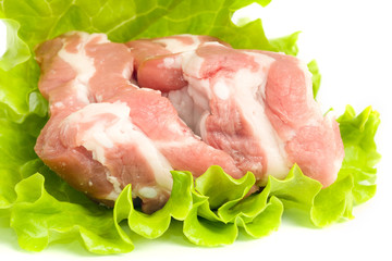 Pork meat on green salad. Isolated