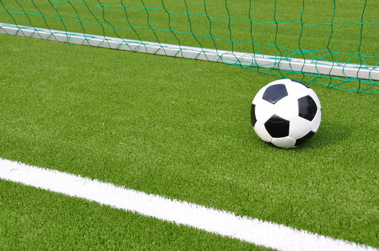 Soccer ball at the goal net