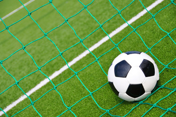 Naklejka premium Soccer ball in the net