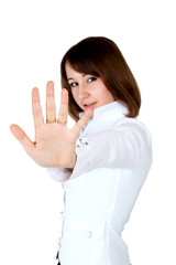 woman in white showing stop. hand in focus