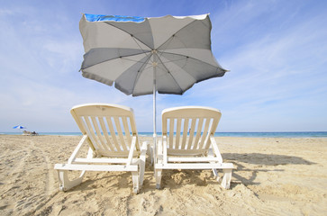 Chairs and umbrella on tropical cuban beach