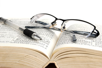 dictionary & pen with glasses