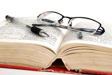 dictionary & pen with glasses