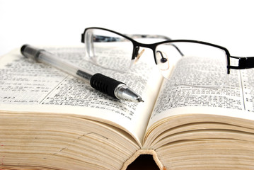 dictionary & pen with glasses