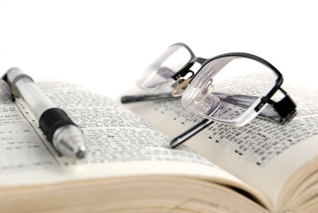 dictionary & pen with glasses