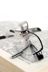 dictionary & pen with glasses