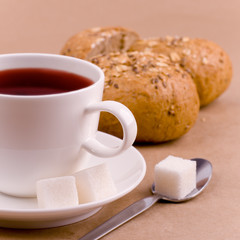 cup of tea, sugar and bread