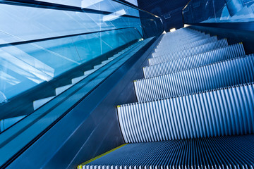 Escalator in blue corridor