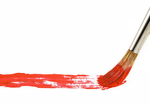 Brush with red paint