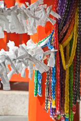 Prayer notes on a backgound of colorful origami cranes
