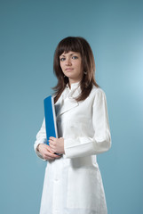 Healthcare collection - Pretty brunette doctor with blue folder