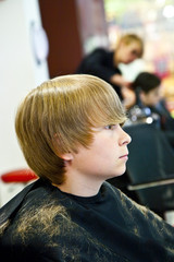 young boy  at the hairdresser