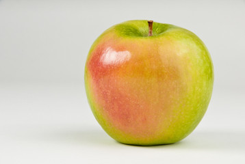 Green apple with red cheek