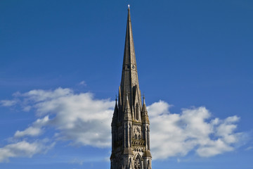 Cathedral tower on the blue sky