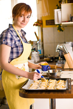 Young woman make Croissant