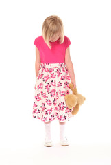Young little girl holding teddy bear