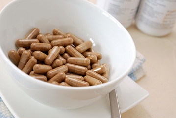 Bowl of medical capsules