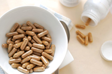 Bowl of medical capsules