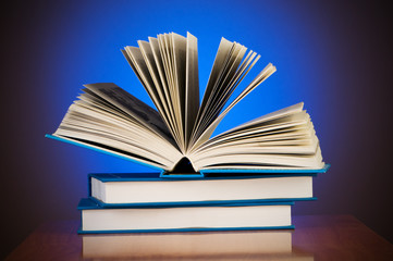 Stack of books against gradient background