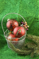 red Christmas baubles in basket