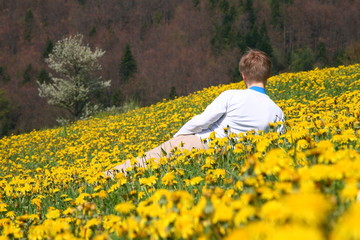 Fototapeta premium Woman in yellow flowers