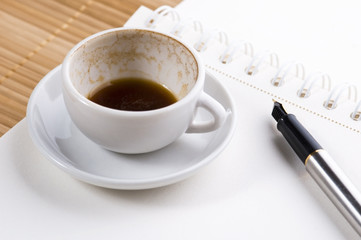 no concept. blank page, empty cup of coffee, pen