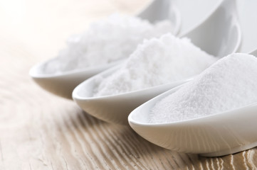three spoons with difrent salt
