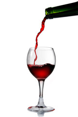 Pouring red wine into the goblet