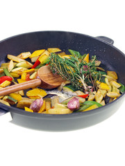 mediterranean vegetables cooking in a pan isolated on white