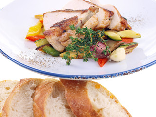 grilled chicken & mediterranean vegetables isolated on white