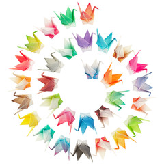 Origami birds arranged in spiral shape and isolated on white