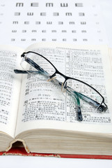 dictionary and glasses