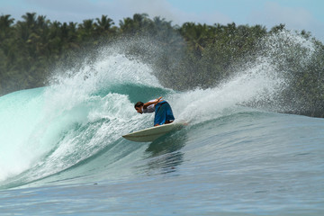 Surfer on wave, Mentawai Islands, Indonesia