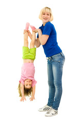 The girl does gymnastics with the child