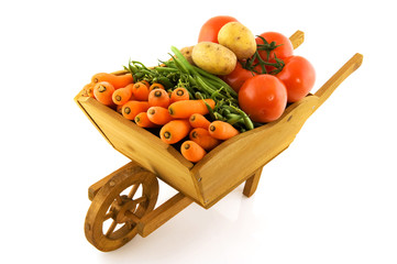 Wooden wheelbarrow with vegetables