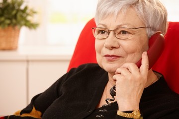 Portrait of senior lady on phone