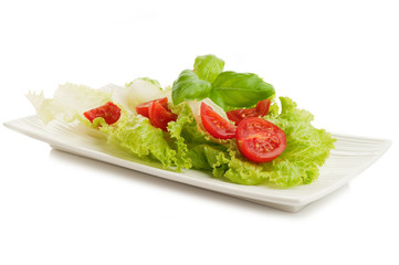tomato and lettuce salad on dish