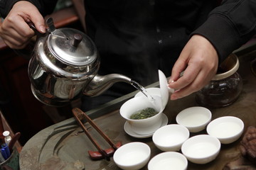 Fototapeta na wymiar Woman makes tea