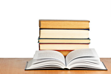 Open book on desk on white background
