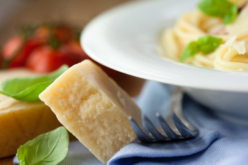 Close-up of parmesan and ingredients for spaghetti