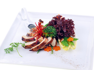 grilled guinea fowl with salad isolated on white background