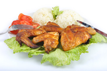 Chicken wings with rice, vegetable and cutlery