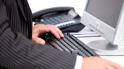 Close-up of a businessman working at a computer