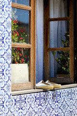 Old shoes on the portuguese window