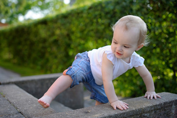 Brave little baby learning to climb © MNStudio
