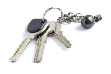 Keys with metal chain and hematite stone isolated on white