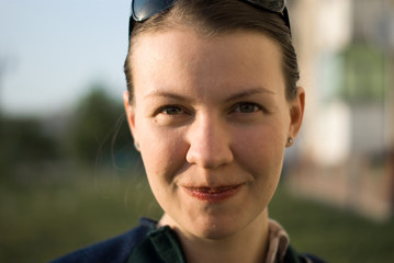 young white woman with coifured hair smiles, close-up